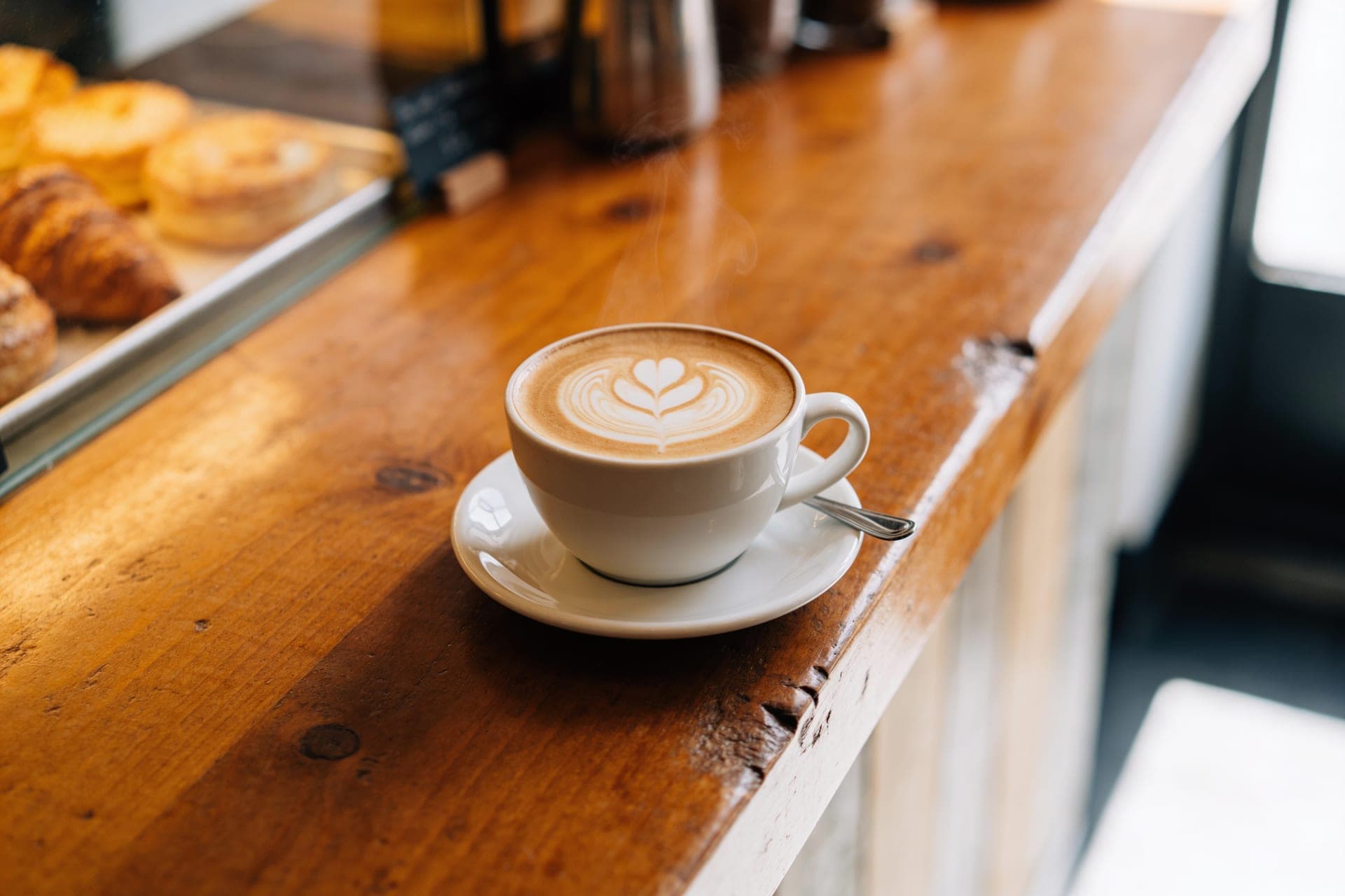 A flat white with latte art on the Marlow & Finch coffee bar